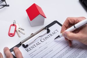 Human Hand Filling Rental Contract Form